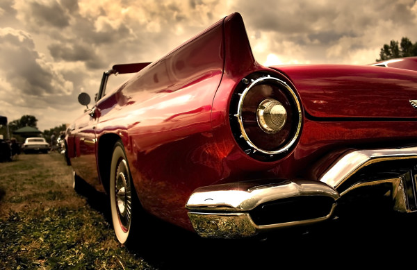 Close up shot of a vintage car in sepia color tone