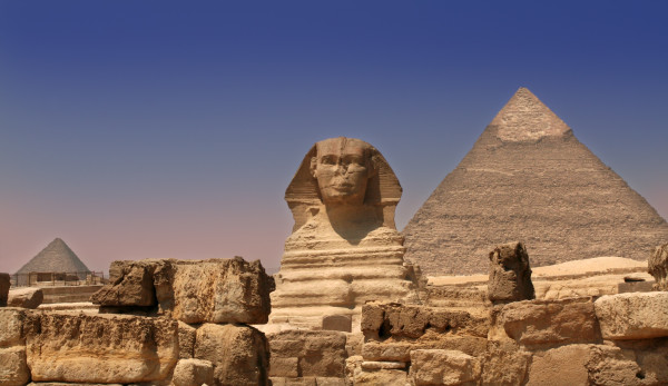 sphinx guarding a pyramid