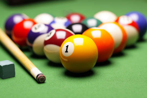 Billiard balls, cue on green table!