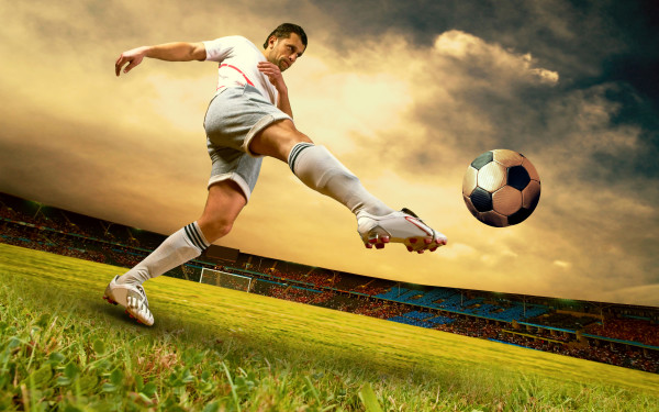 Happiness football player on field of olimpic stadium on sunrise