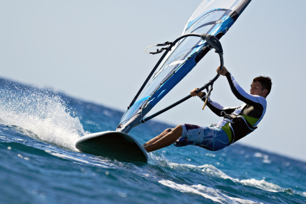 Side view of young windsurfer