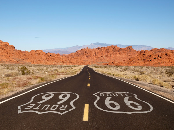 Route 66 Pavement Sign with Red Rock Mountains