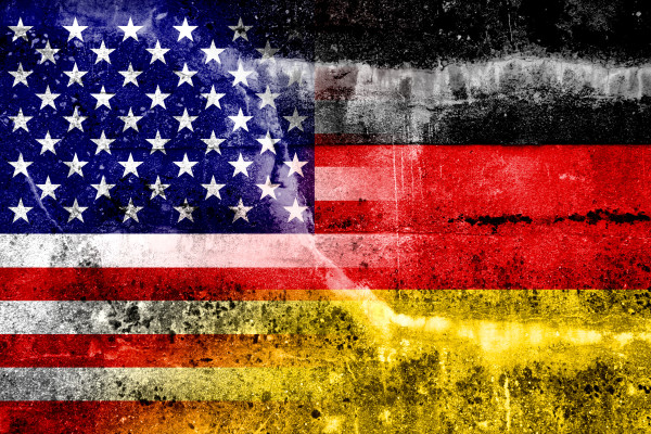 USA and Germany Flag painted on grunge wall