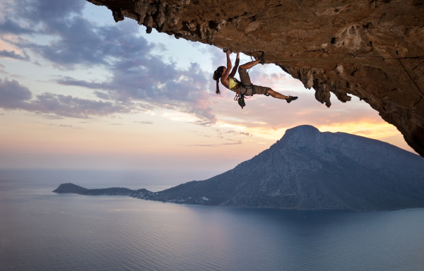 Young female rock climber at sunset, Kalymnos Island, Greece