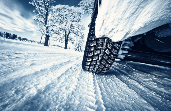 Car tires on winter road