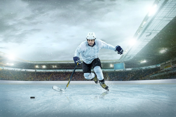Ice hockey player on the ice. Open stadium – Winter Classic game