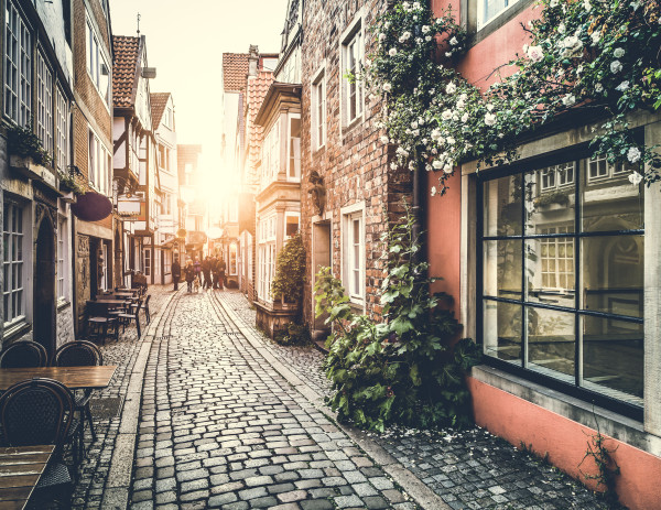 Historic street in Europe at sunset with retro vintage effect