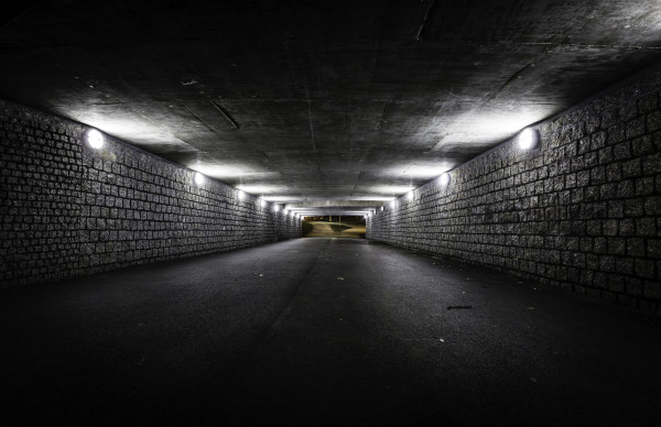 Empty dark tunnel at night