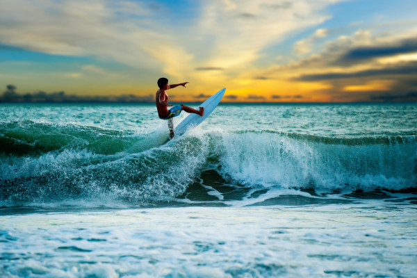 Athletic surfer with board