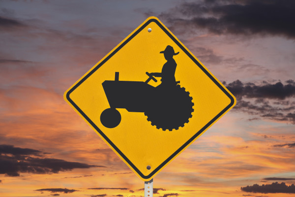 Farmer Tractor Crossing Sign with Sunrise