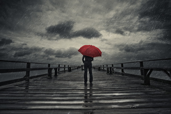 Red umbrella in storm