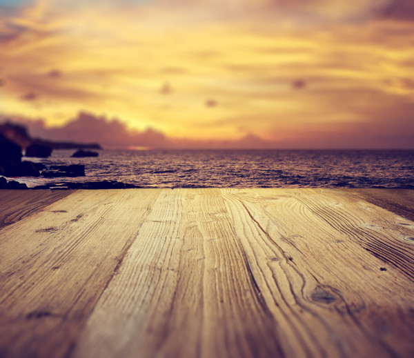 wooden table background on the tropical  beach