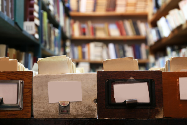 Catalog cards and books in library, closeup