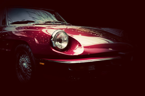 Retro classic car on dark background. Vintage, elegant