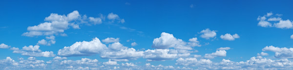 White heap clouds in the blue sky.