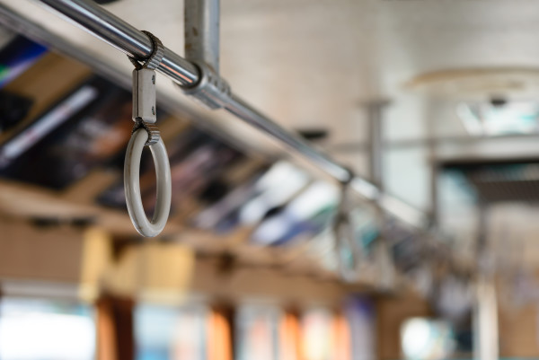 Handle on ceiling of bus.