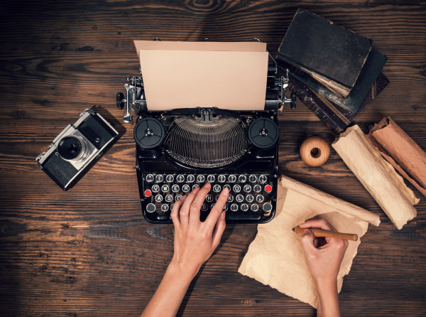 Retro typewriter on wooden planks