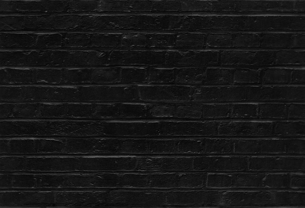 Seamless black brick wall pattern texture background