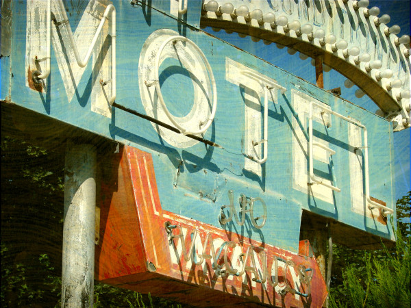 aged and worn vintage photo of neon sign