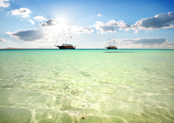 Two sailboats in sea