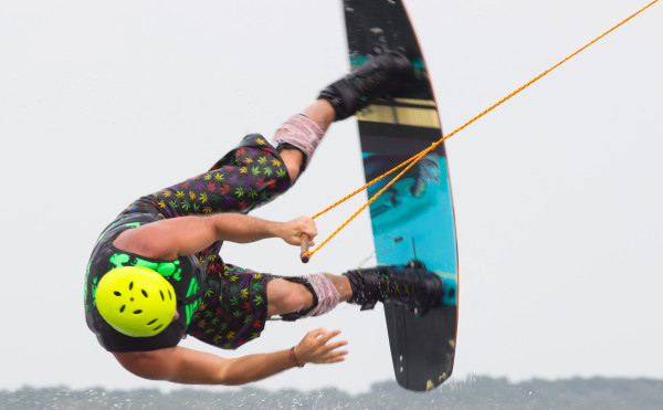 A young man jumps the wakeboard