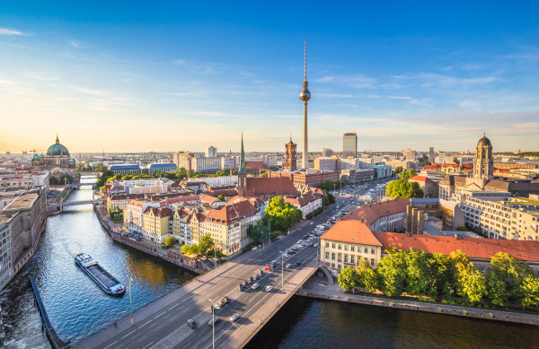 Berlin skyline panorama with TV tower and Spree river at sunset, Germany