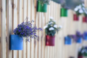 flowerpot hooked on a wooden fence