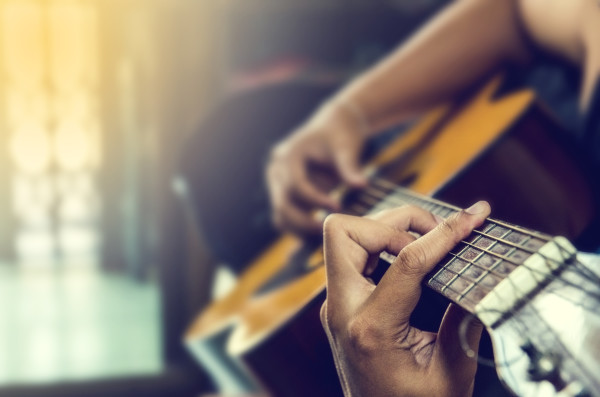 hand of man in classical guitar