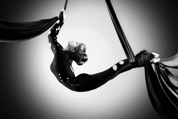 Beautiful dancer on aerial silk, aerial contortion, aerial ribbo