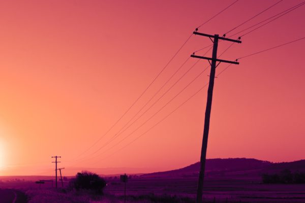 Timber power line pole with sky in the background during the day in Queensland