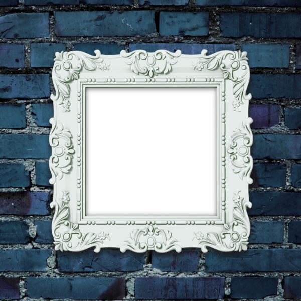 Close-up of one decorated picture frame on dark blue brick wall background