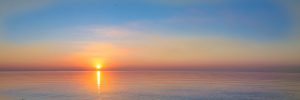 landscape – sunset on the coast, waves, horizon. top view.