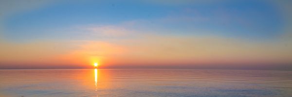 landscape – sunset on the coast, waves, horizon. top view.