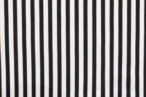 Navy blue and white striped background. Vertical stripes pattern on fabric.